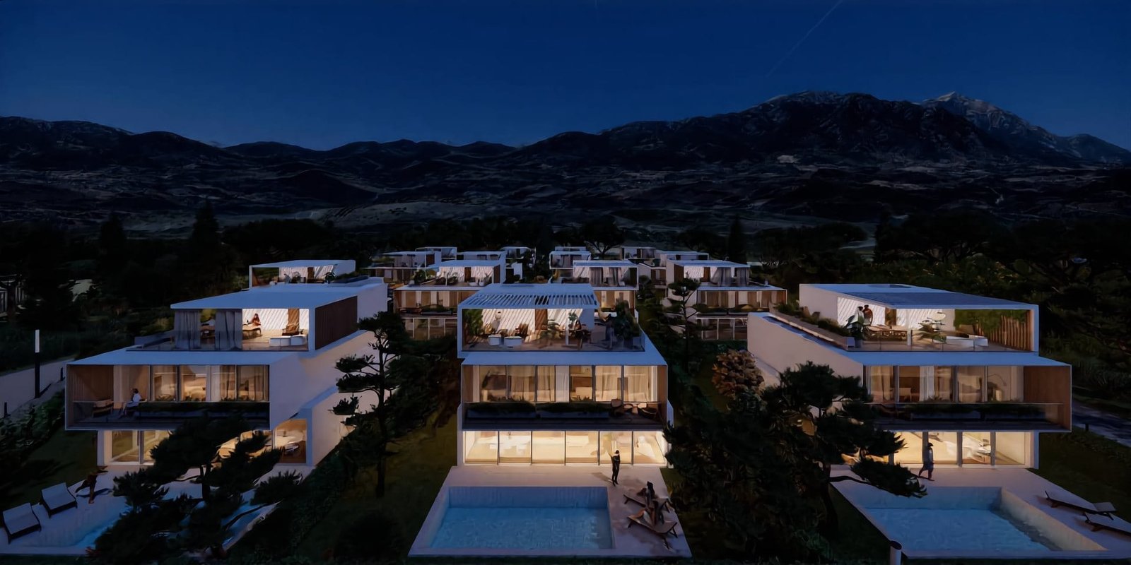 The Great Residences at night, with lit homes and pools