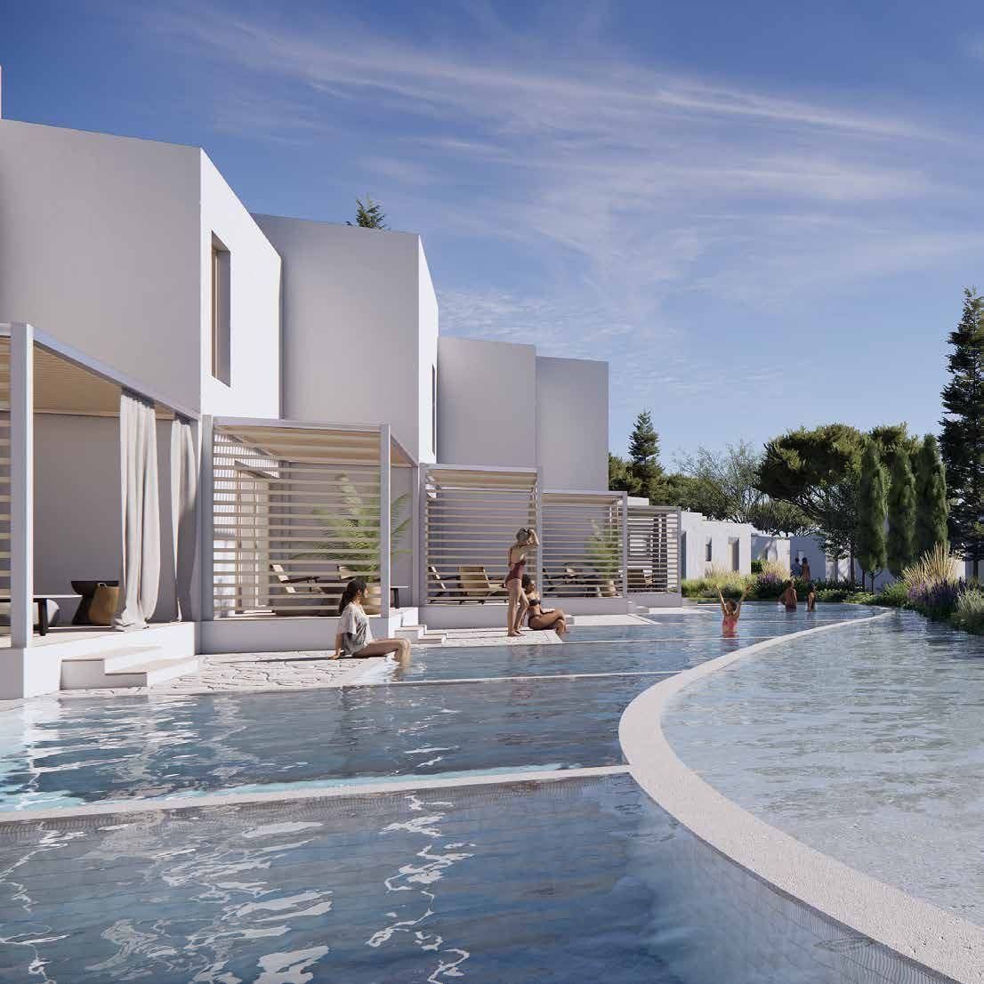 Resort suites opening onto a lagoon pool at The Great